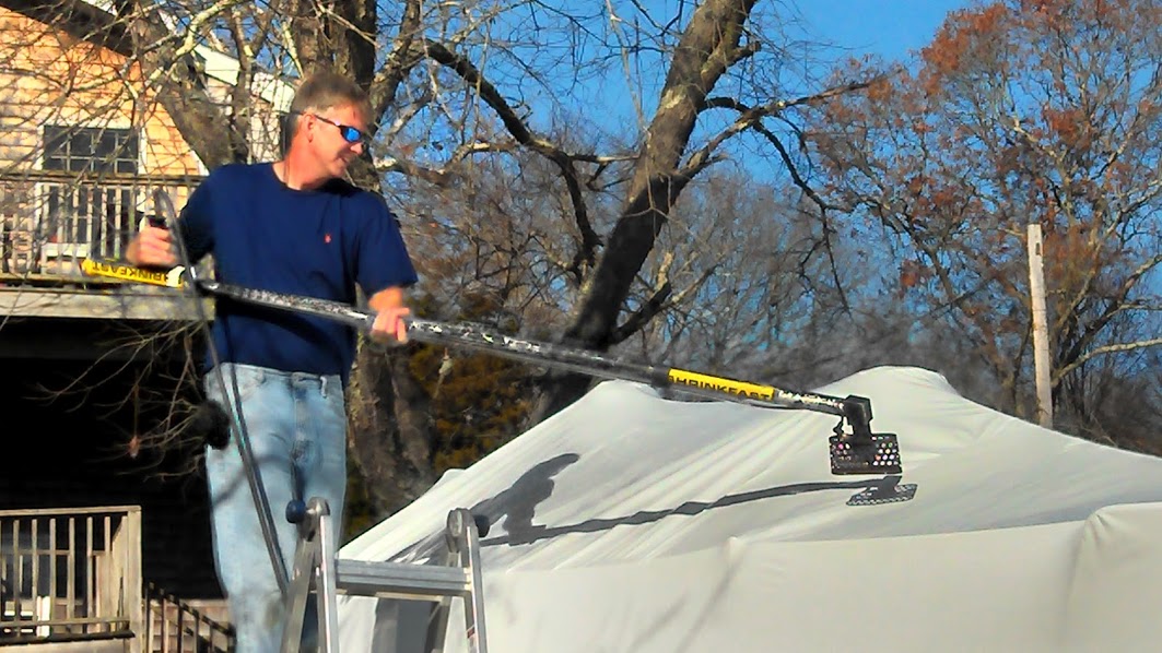 Peter Chappell shrink wrapping a boat @ Pete's Marine Services